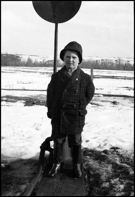 Ron V. Nixon is photographed standing on a switch stand at Roberts, MT 