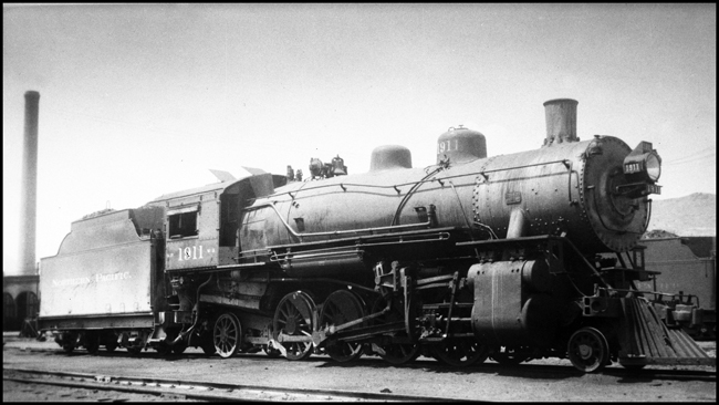NP 1911, Class W-2 just off the turntable track in front of Livingston Roundhouse.  Stationary Stack in background.