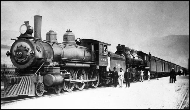 NP Train No. 1 doubled headed by NP 338, Class E-3 formerly NP 660, and NP 290 at Missoula, MT.
