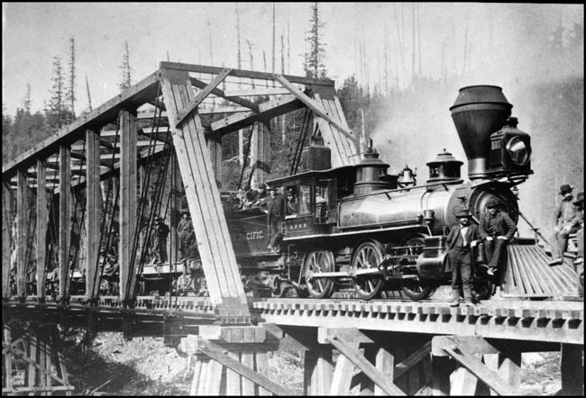 NP 137 later renumbered to NP 970, Class K-1  as seen 43 miles E of Tacoma. Railroad workers posing on train.