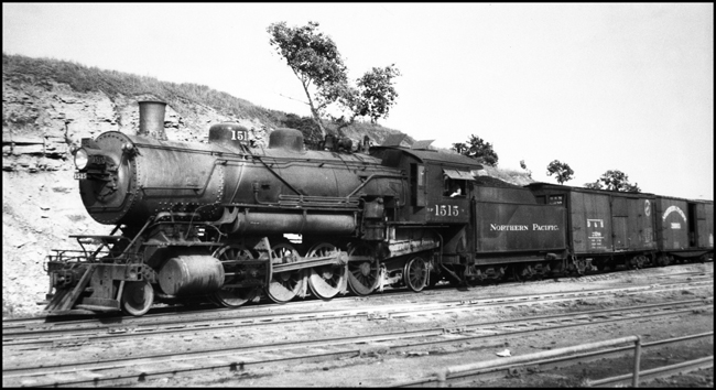 NP 1515, Class W hooked onto freight drag in Northtown yard, probably making a switch move.