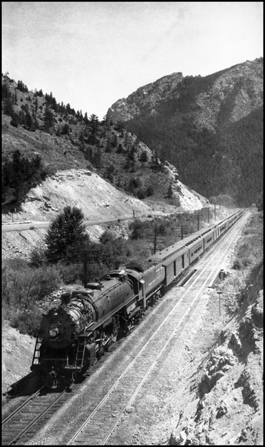 2nd section Train No. 1 with NP 2650, Class A-2 emerging from Rocky Canyon near Mount Ellis. Toad Rock is on top of the mountain in the background. 