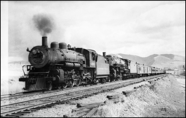 NP Train No. 1 double headed by NP 2212, Class Q-1 and NP 2601, Class A moving east of DeSmet, MT