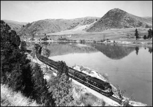 NP Train X7007D-E with 8 units east of Perma, MT, alongside of Flathead River.