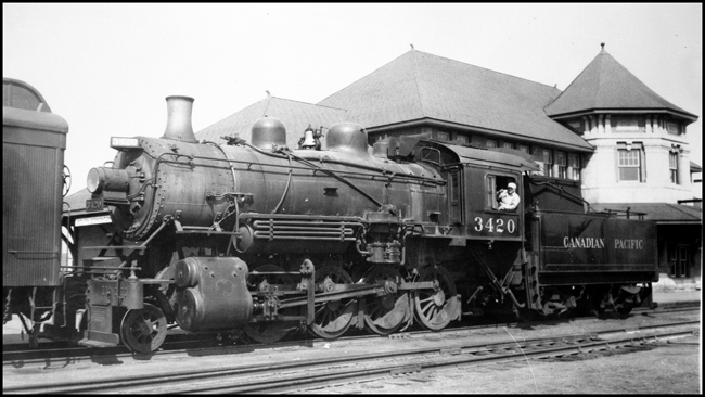 CPR 3420, 2-8-0 coupled to a passenger car in the Edmonton Depot area.
