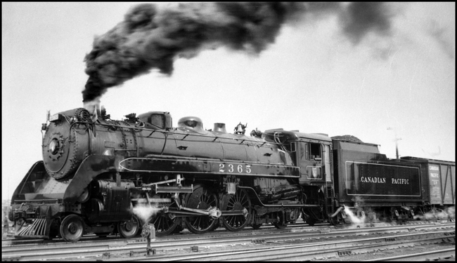 CPR 2635, 4-6-2 moving under steam with black exhaust in Winnipeg.