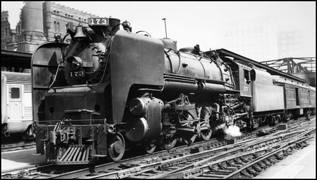 NKP 173,4-6-4, locomotive with aerodynamic shielding on passenger train in Chicago