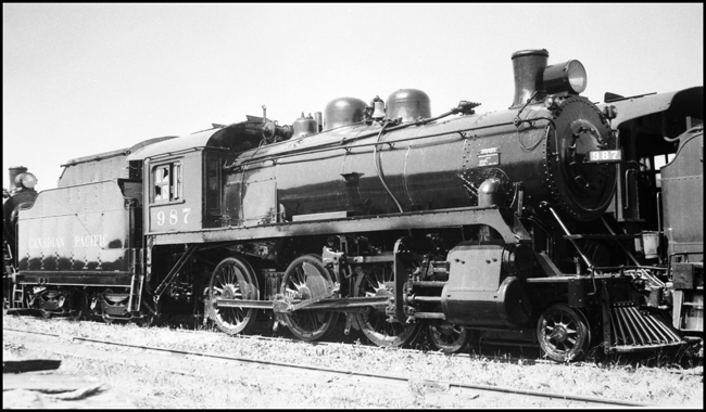 CPR 987, 4-6-0 in storage at Winnipeg, with broken cab windows 