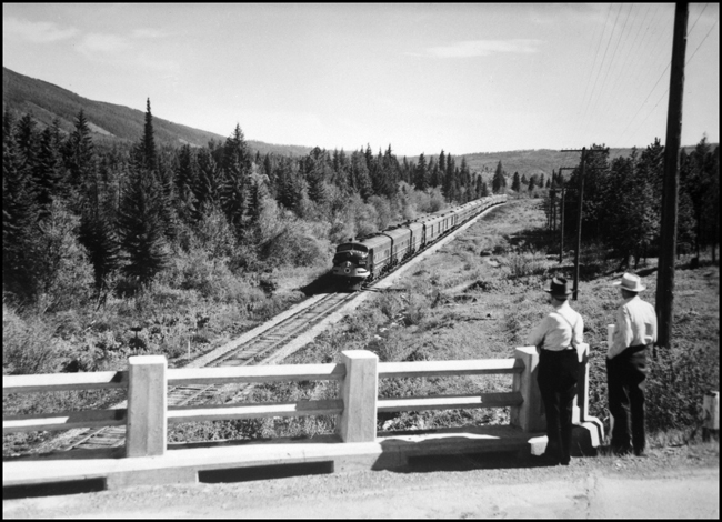 NP Train No. 1 with NP 6510 leading west of Evaro, with WN and MGN watching train go past.