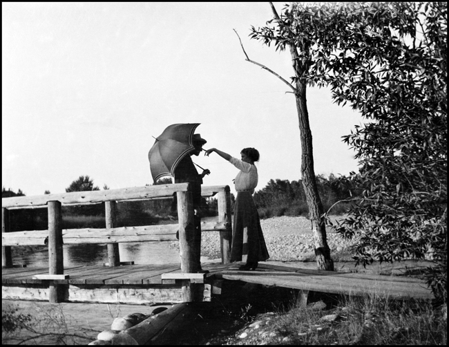 William Nixon and Elizabeth CP (who became Ron Nixon's mother), standing on bridge probably over the Boulder River.