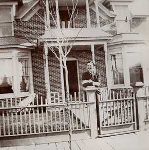 James R. Reid Leaning on Fence Post