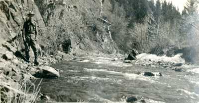 Man Standing on Left Bank of River