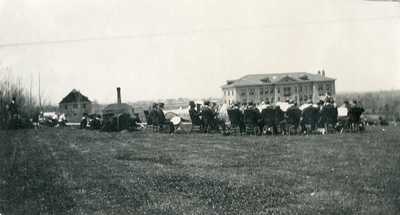Band Concert Members Seated on the Lawn of Montana State College