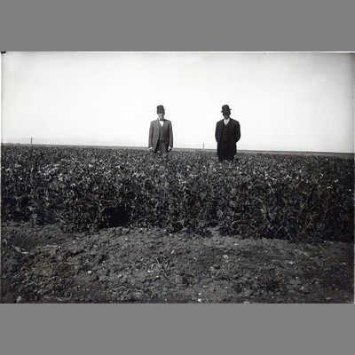 Alfred Atkinson and Unidentified Man Standing in Field, 1911