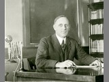 Alfred Atkinson at Desk