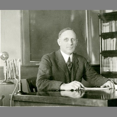 Alfred Atkinson at Desk