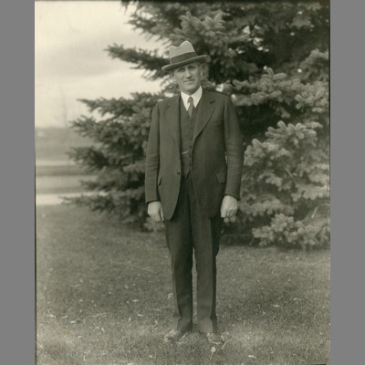 Alfred Atkinson in Front of Pine Tree