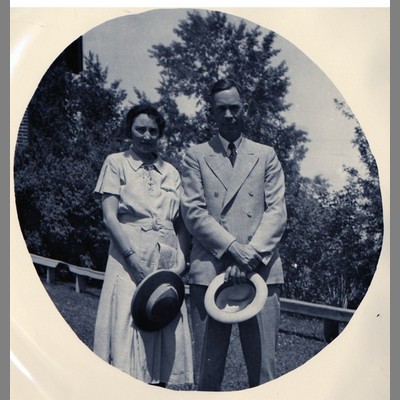 A. L. Strand and Mollie Strand Holding Hats