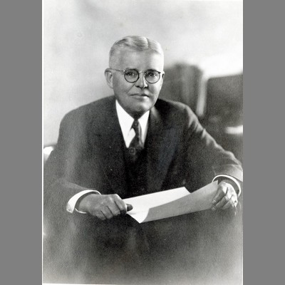 William M. Cobleigh at Desk