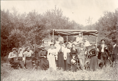 James R. Reid and Others posing near wagon, 1905