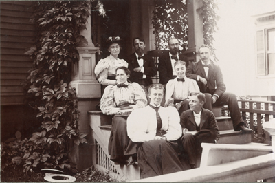William M. Cobleigh, laughing, Sitting on Porch with Others, 1895