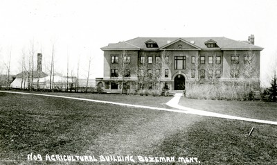 Montana State College Agricultural Building with greenhouses attached.