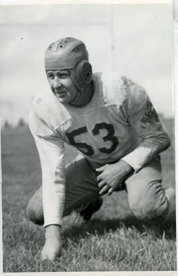John Burke Crouching in uniform, 1940-1941 football team