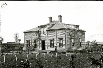 S.M. Emery outside of a Farm Dwelling, 1896