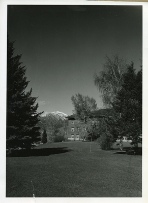 Herrick Hall behind trees.
