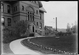 Montana Hall, west entrance showing heating plant, 1908