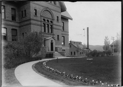 Montana Hall, west entrance showing heating plant, 1908