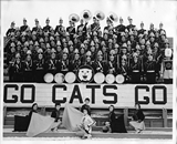 Montana State College marching band seated on bleachers, 1932