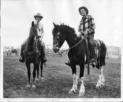 Olleen Korell and Ed Atkins riding horses