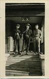 Sigma Chi members "Torchy" Swan and Lorren Bradford on porch of house, 1921