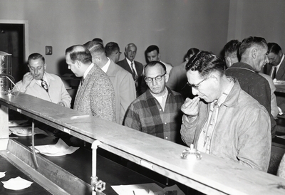 A group of men enjoy a dairy snack at the D.M. Short Course, 1958/1959