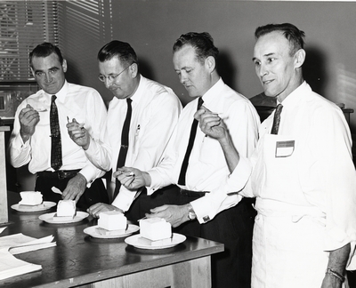 John L. Brence and others enjoy a dairy snack at the D.M. Short Course, 1958/1959