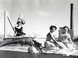 Homecoming royalty candidates riding a float during the homecoming parade, 1947