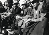 The audience watches the homecoming football game, 1947