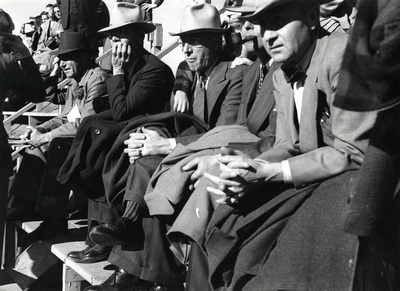 The audience watches the homecoming football game, 1947