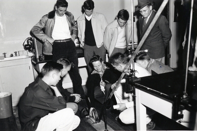 A group of male Students Conducting an Experiment