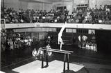 Men preform gymnastics in the Romney Gym