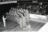 Montana State College Choir performing in Romney Gym