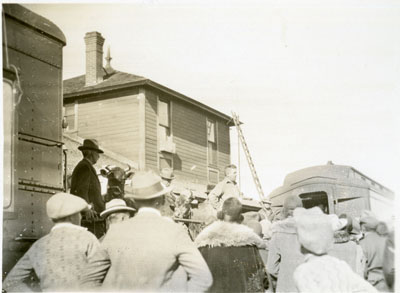 Crowd looking at cattle on a flatcar of the Better Livestock Special