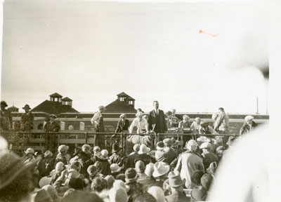 Man addressing a crowd from a flatcar of the Better Livestock Special Train