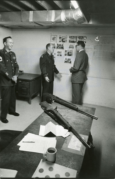 Senator Lee Metcalf and two military men at Montana State