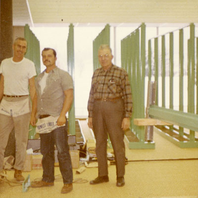 Workmen building book shelves during the library move, November 1966