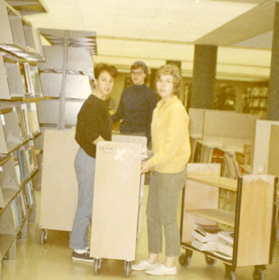 Jennifer, Sandy Horpestad and Caron Pederson during the library move, November 1966