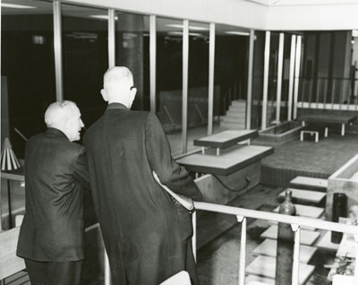 Dr. Renne and Dr. Strand overlooking the library lobby, 1962