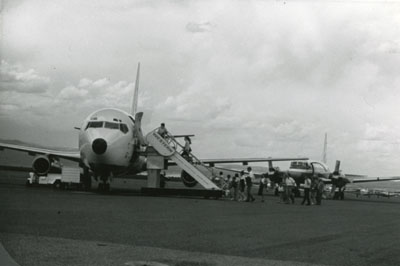 People boarding an airplane, part of the Gallatin Canyon Study Photos