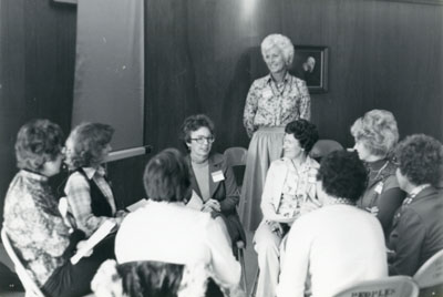 Scottie Giebink and a group of women at Focus on Women, 1976